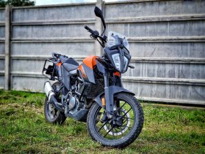 ktm 390 adventure equipped with aluminium lateral cases panniers koffer, valise, crash bar and panniers rack carrier