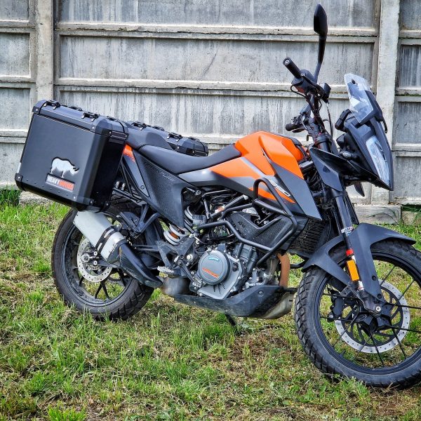 ktm 390 adventure equipped with aluminium lateral cases panniers koffer, valise, crash bar and panniers rack carrier