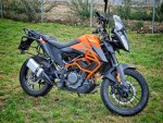 ktm 390 adventure equipped with aluminium lateral cases panniers koffer, valise, crash bar and panniers rack carrier