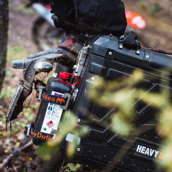Motorcycle-mounted fuel canister & bottle holder system built for long-distance and off-road adventures.